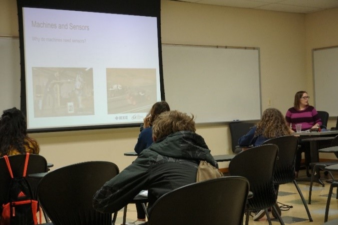 UNT faculty giving presentation to students in a classroom
