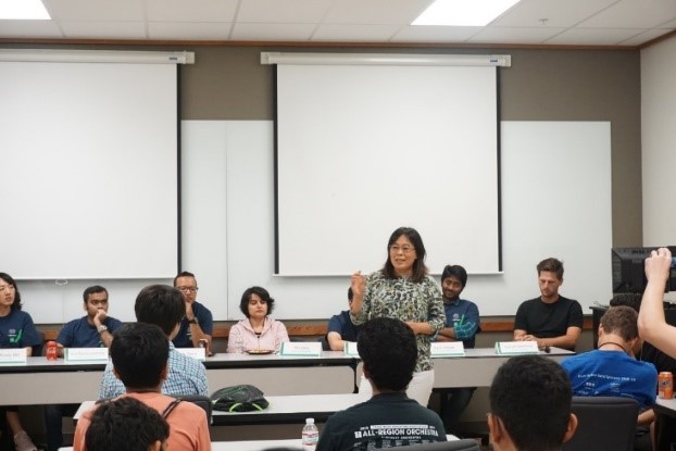 UNT faculty talks to students in a classroom