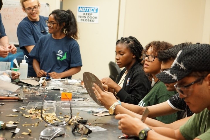 Multiple students working at a table