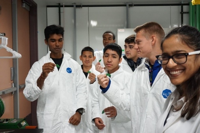 Students conduct an experiment in a university lab.