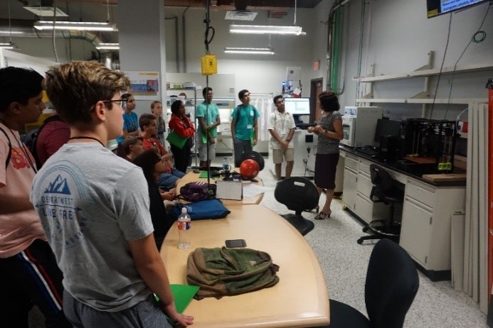 UNT researcher talks to students in a lab